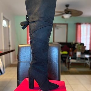 Thigh high black boots